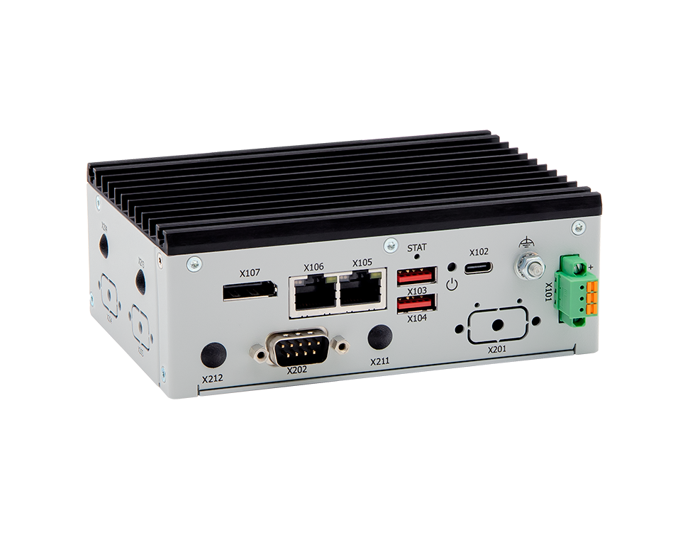 Compact industrial computer with multiple ports and connections, including Ethernet, serial, USB, and power inputs. The device features a ribbed metallic casing for heat dissipation.