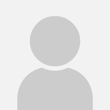 A generic placeholder silhouette representing a person, featuring a gray figure with a circular head and rounded shoulders on a plain white background.