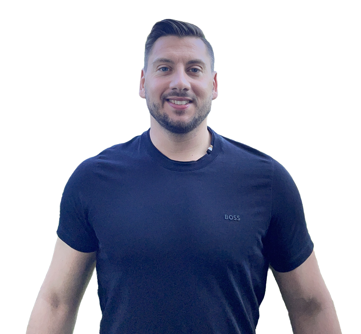 A smiling man stands facing the camera, wearing a black t-shirt with the word "BOSS" printed on it. He has short, styled hair and a friendly demeanor. The background is plain white.
