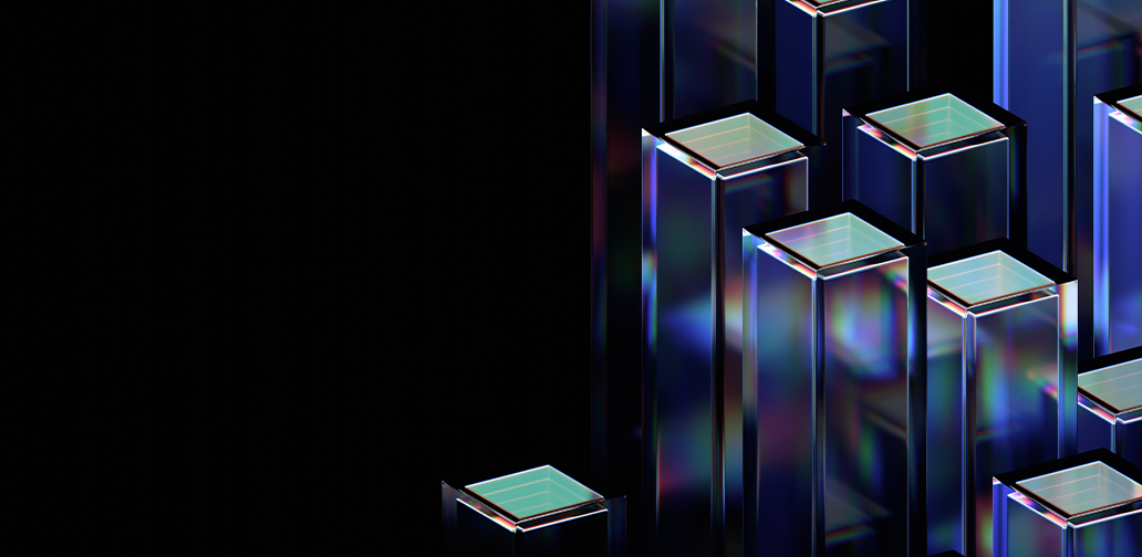 Colorful, translucent 3D geometric shapes resembling columns or rectangular prisms are arranged asymmetrically against a black background. The shapes have reflective surfaces that create a shimmering effect.